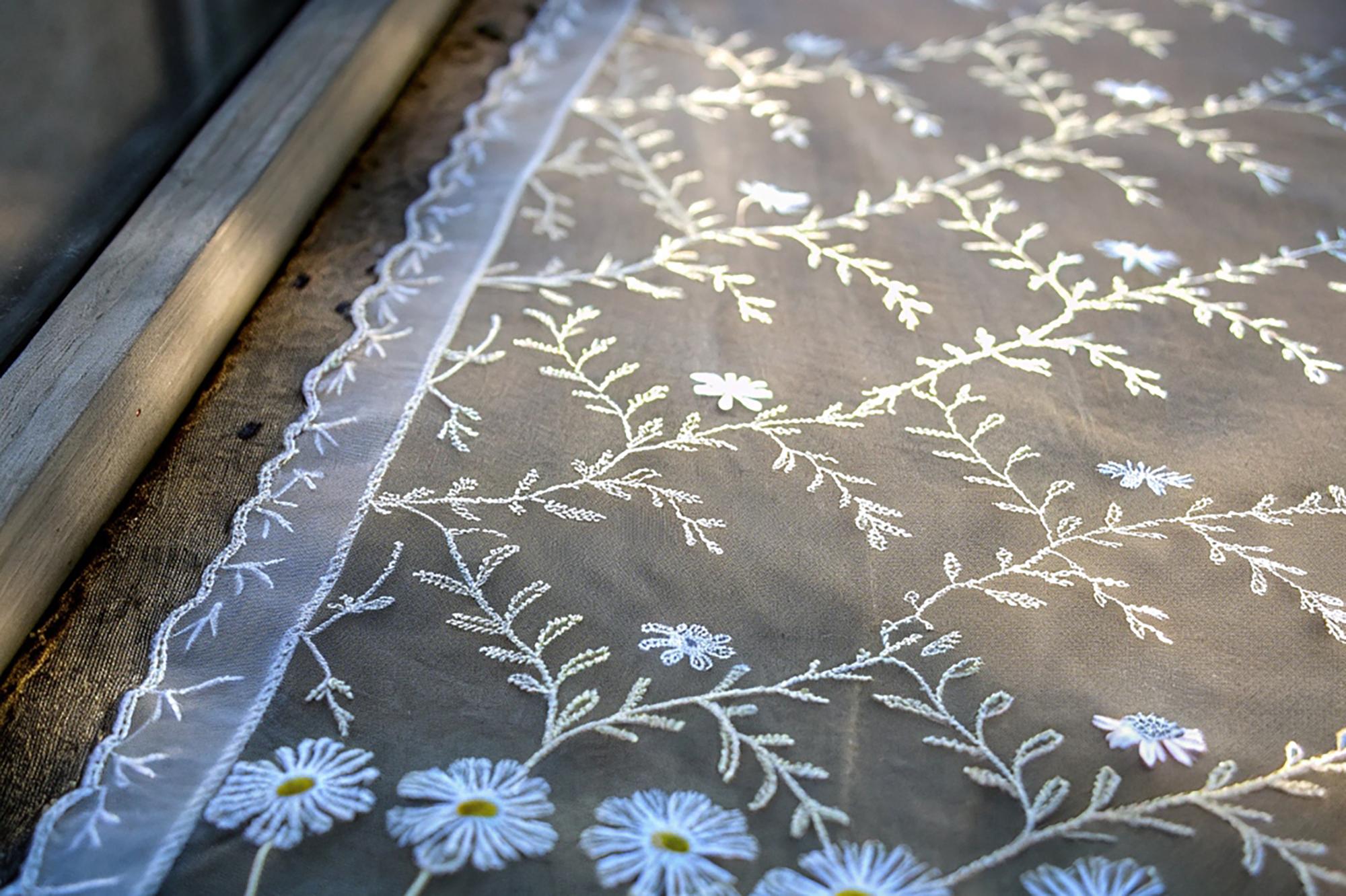 embroidered linen table runner with floral motif